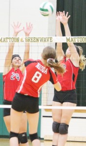 Photo by Keith Stewart Kailyn Boyer (no. 24) and Emily Neuhauser (right) attempt to block Neoga’s Jaycie Roy during their 5 p.m. game Saturday at the Mattoon Tournament.