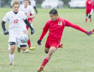 Photo by Keith Stewart Jovanny Martinez (no. 12) goes to volley the ball Saturday afternoon against Effingham St. Anthony. Martinez’ volley would score and earn the Knights a 1-0 victory.