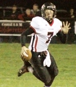 Photo by Joe Wheeler Nick Frerichs scrambles out of the pocket Friday night.