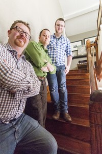 Photo by Keith Stewart John Stephens (front left), Timmy Valentine (middle) and Tyler Mosier (back) stand on the staircase of the former Harrison Street Inn, which was recently named to Reboot Illinois’ top 50 Most Haunted in Illinois list.