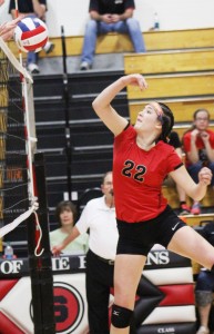 Photo by RR Best Emily Seegmiller attempts a hit over the net but is met with  Tuscola’s front line blocking, which kept no. 22 at bay all night.