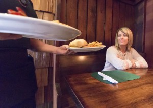 Photo by Keith Stewart Amy Fultz prepares to enjoy her ribeye sandwich for lunch Tuesday at Lucky’s Food and Spirits in Sullivan.