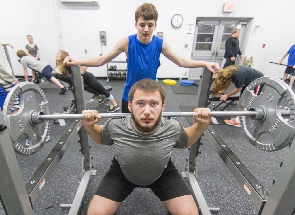 Photo by Keith Stewart Okaw Valley sophomore Connor Dotson squats Tuesday morning while Jonathan Gentry spots from behind. The new squat rack is just one of several new pieces of equipment purchased thanks to a collaborative donation effort.