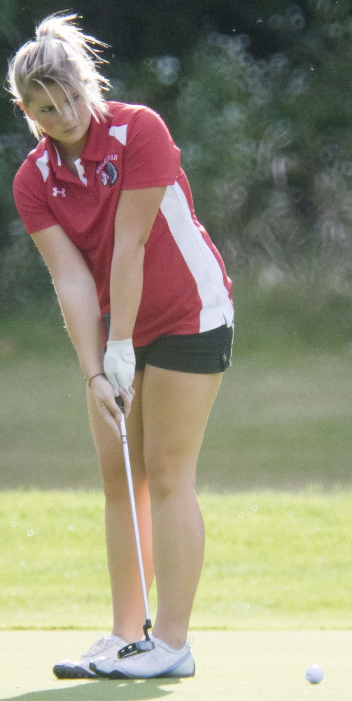 Photos by Keith Stewart Ariel Heppe putts during last Wednesday's golf match at the Sullivan Country Club.