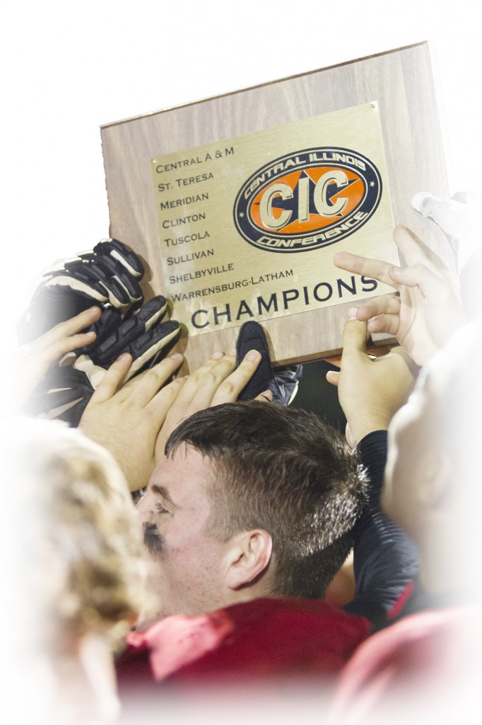 Members of the SOV football team hold up their Central Illinois Conference championship plaque Friday night after defeating Clinton 54-14. The Redskins split the title with St. Teresa, who also finished 6-1 in the conference after a week seven loss to Shelbyville.