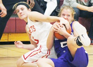 Photo by Darian Hays ALAH’s Elyse Harris (left) forces a jump ball during Monday night’s contest against Shelbyville.