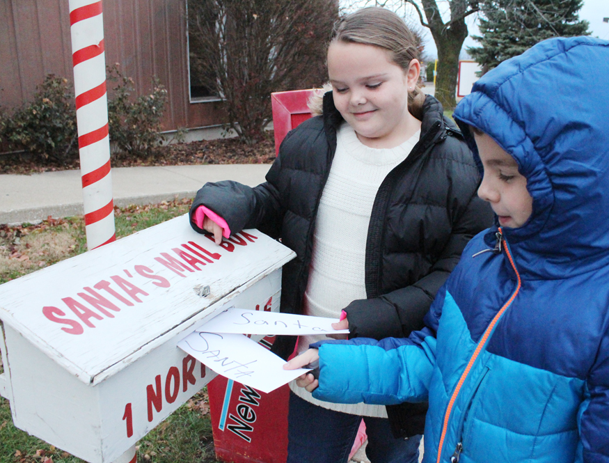 Photo by RR Best NP Accepting Santa Letters Cami and Conner Denton place their letters to Santa in his mailbox Monday outside of the News•Progress office. Letters may be dropped in the mailbox or emailed to santa2014@newsprogress.com up through Friday, December 12 by 5 p.m. For more information, call 728-7381. Santa letters will be printed in the December 17 edition of the News•Progress.