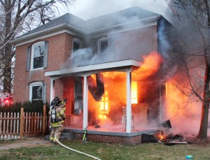 Photo by RR Best Area firefighters prepare to extinguish a house fire located at 115 W. Mattox in Sullivan last Wednesday evening.