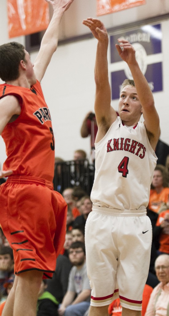 Photo by Keith Stewart The Knights' Jeremy Plank fires from beyond the arc Tuesday. Plank, who was later chosen as the Tri-County holiday tournament MVP, knocked down five 3-pointers in his team's 47-44 loss to Paris.