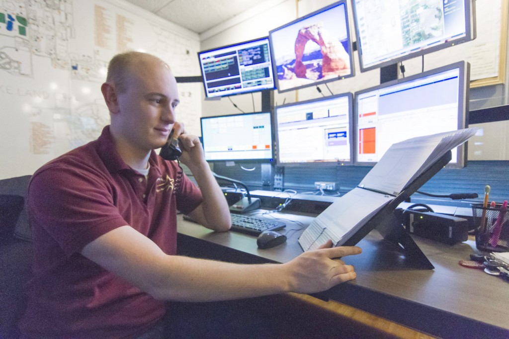 Photo by Keith Stewart A.J. Roley, a 911 dispatcher at the Coles County Emergency Communications Center, handles an emergency call last Thursday night.