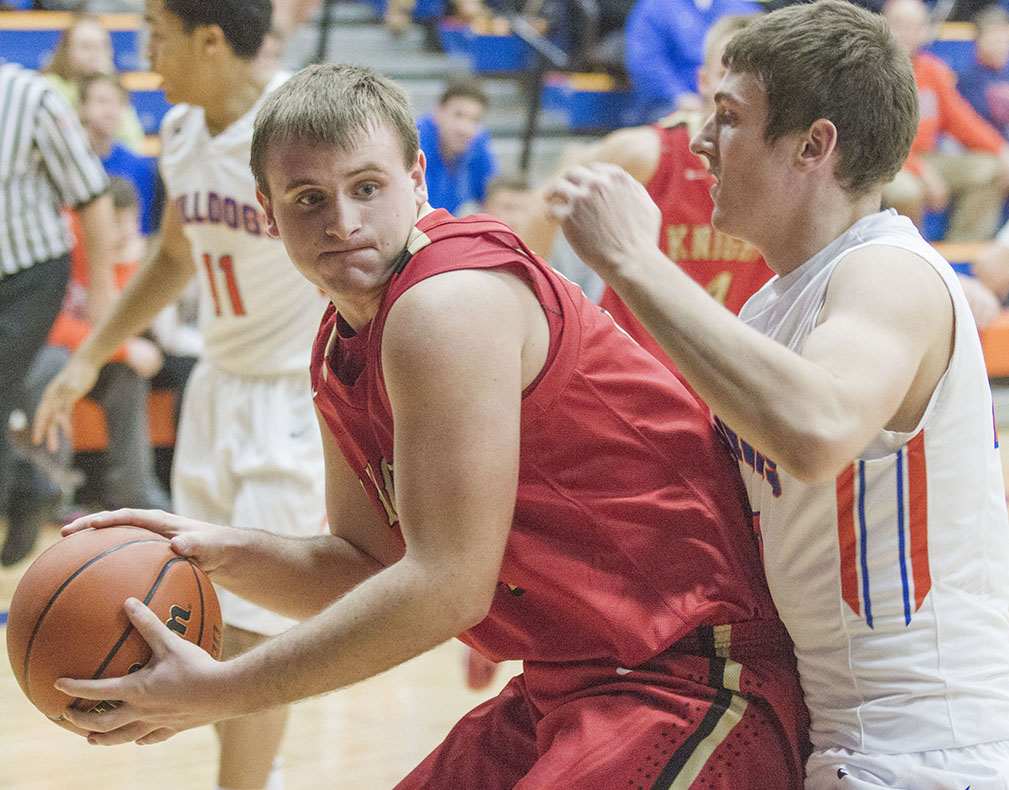 Photo by Keith Stewart The Knights’ Colton Yeakley pauses before going back up for the bucket Tuesday evening. Yeakley left the game with over three minutes left in the first quarter after he was struck above the left eye.