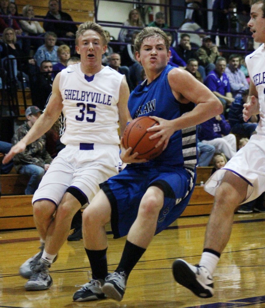 Photo by RR Best Peyton Hagerman drives between two Shelbyville defenders Friday night. The senior tallied 22 points to help lead his team to a 68-58 win.