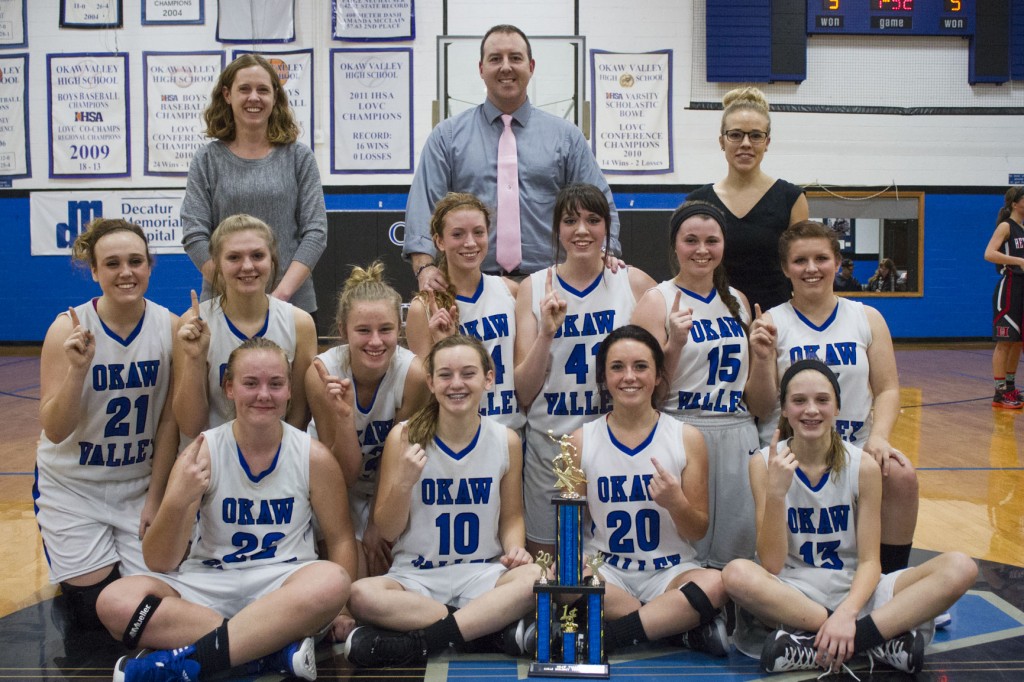 Photo by Keith Stewart The Okaw Valley varsity girls' basketball team secured their holiday tournament crown Tuesday evening with a 55-41 win over Heyworth.