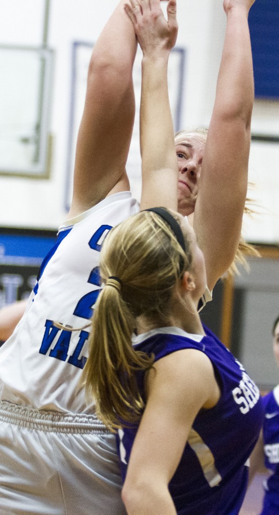 Photo by Keith Stewart Okaw Valley’s Amy Orris goes up and over a Shelbyville defender Monday morning. Orris led her team with 19 points and 10 rebounds in their 54-37 win over the Rams.