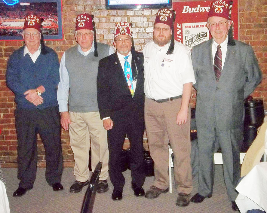 Submitted Tri-County Shriners Christmas Party The Tri-County Shrine Club held its Christmas party and installation of officers for the coming year on Thursday, December 2 at the Berg in Arthur.  The following officers were installed by Noble Ed Camacho, Assistant Rabban, of Ansar Temple in Springfield.  Nobles Tom Wilson, Treasurer; Charles Steck, Secretary,;Frank Lincoln, Vice President; and Jeremy Malin, President.  A check for $3,500 from the club was presented to Noble Comacho for the Crippled Children’s Hospital in St. Louis. The Tri-County Club is made up of Shriner’s from Moultrie, Douglas and Piatt Counties. Pictured from left to right are: Tom Wilson, Charles Steck, Ed Comancho, Jeremy Malin, and Frank Lincoln.