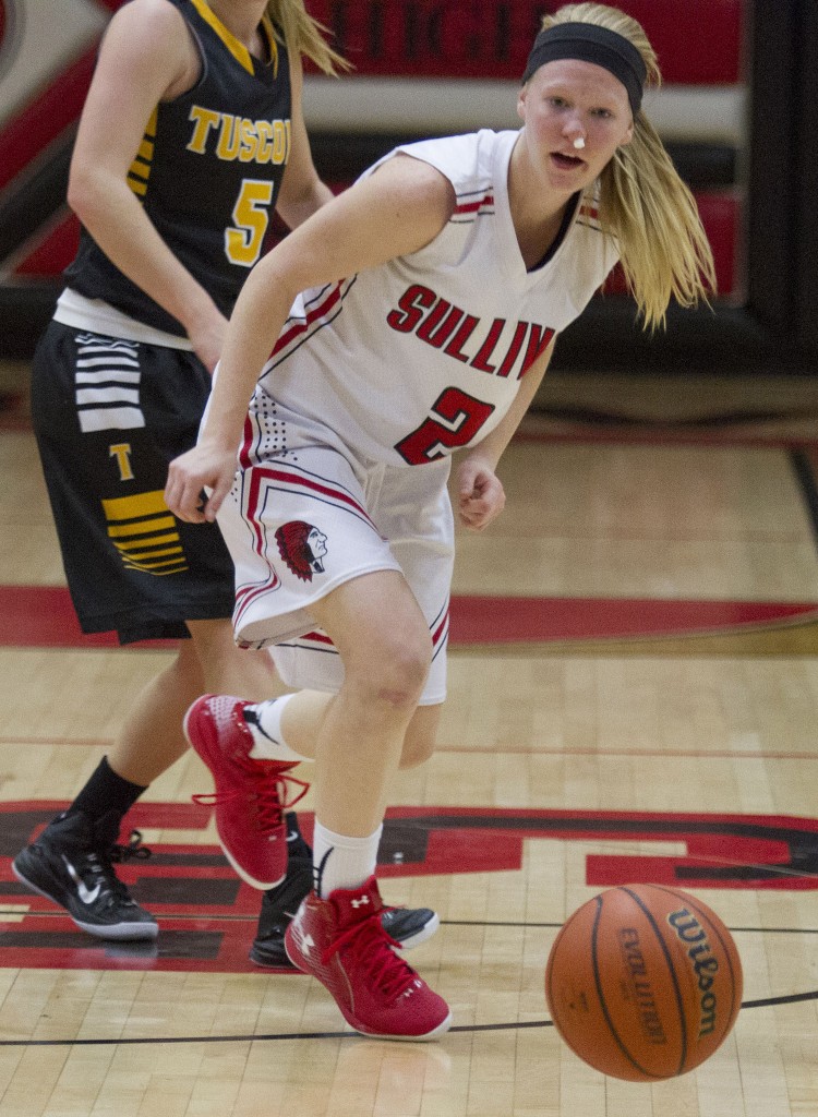 Photo by Keith Stewart Sullivan's Elissa Stewart watches the loose ball after stripping it away from Tuscola Thursday night. Stewart's five steals were part of her team's 16 on a night where the Lady Red won the conference opener 61-40.