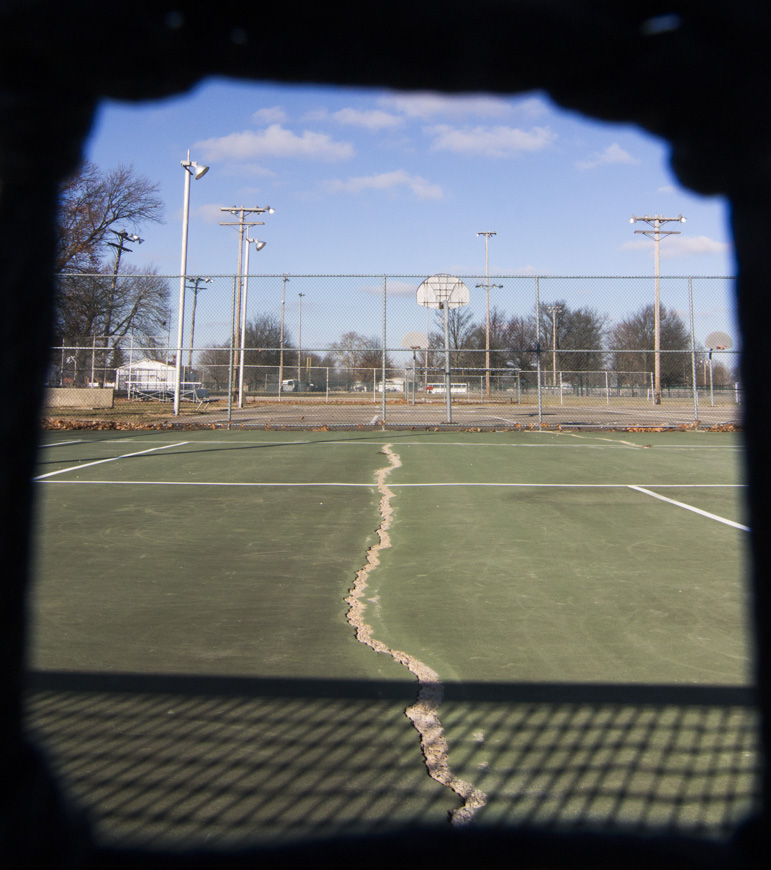 Photo by Keith Stewart A long crack can be seen running through one of the two tennis courts at Wyman Park.