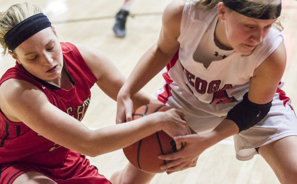 Photo by Keith Stewart Elyse Harris (left) fights Neoga’s EC Thiese for the ball Thursday.