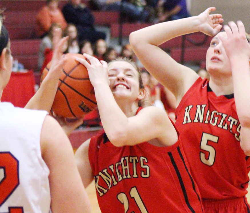 Photo by RR Best Arthur-Lovington/Atwood-Hammond’s Payton Wellbaum tries to hold on to the ball Saturday evening. Wellbaum contributed eight points and pulled down several crucial rebounds in the Lady Knights’ third place victory over Tri-County.