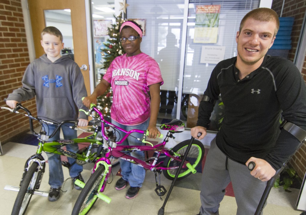 Photo by Keith Stewart Joc French (right) recently donated four bikes to four randomly selected Lovington grade school students. This year’s winners include Koby Brownlee (left), Shalonda Hettinger (middle), and not pictured Jaydin Smith and Normal Mendez. Also not pictured are Joc’s wife Amanda and daughter McKenzie.