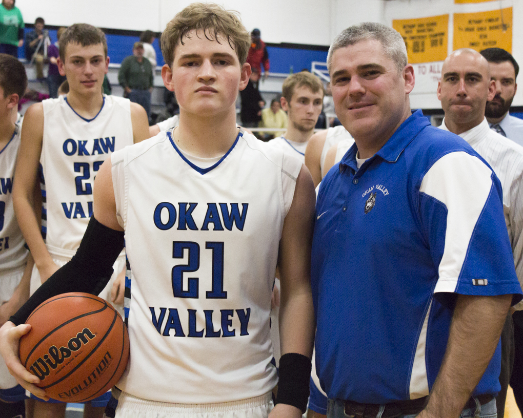 Photo by Keith Stewart Peyton Hagerman (left) stands with Okaw Valley high school Principal Matt Shoaff (right) after scoring his 1000th career point Friday.