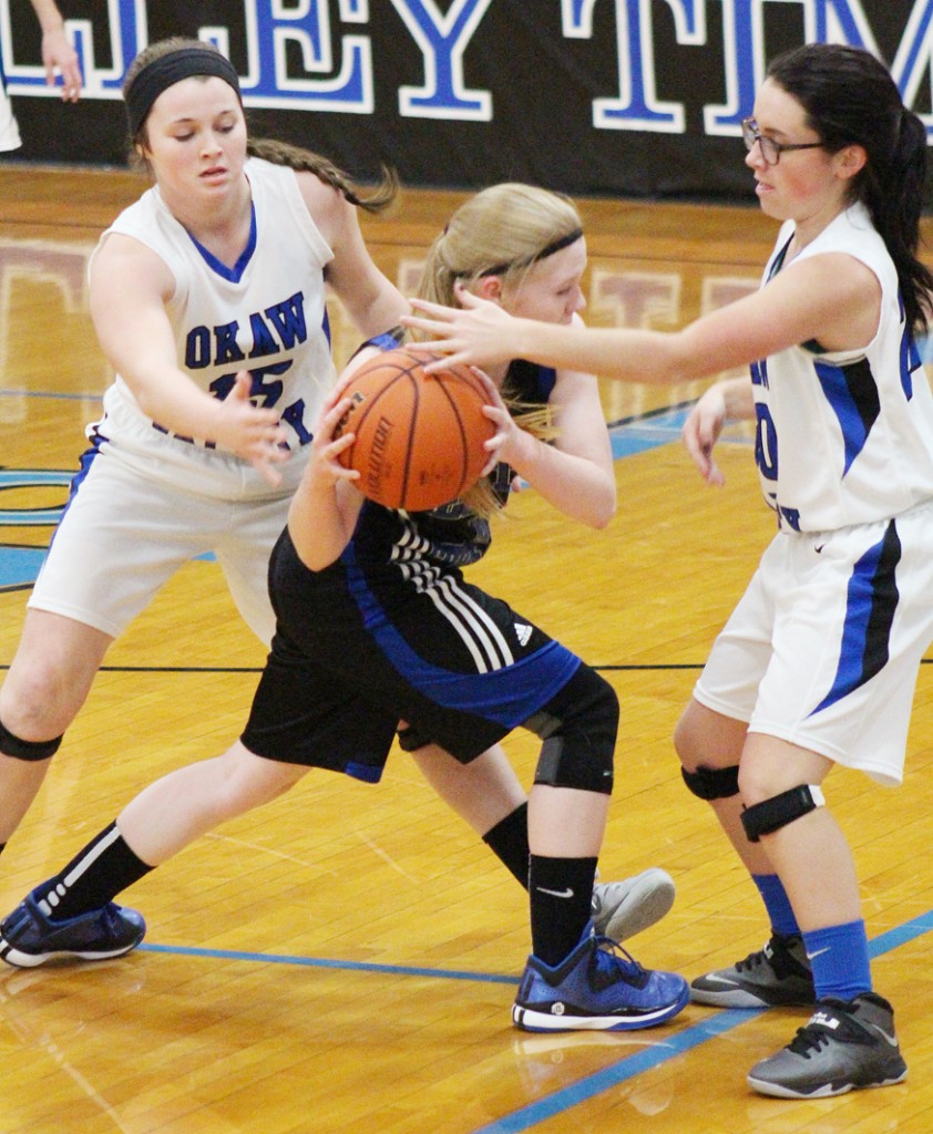 Photo by RR Best Natalie Jeffers (left) and Paige Harlin (right) double team a Decatur Christian player Monday evening. The Timberwolves’ defense locked down the stretch to ensure the 63-32 win.