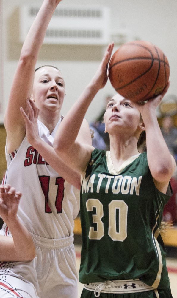 Photo by Keith Stewart Sullivan’s Brittin Boyer tries to make the block from behind on Mattoon’s Abrienne Lee Monday. Boyer was a juggernaut on offense scoring 32 points and bringing down 19 rebounds.