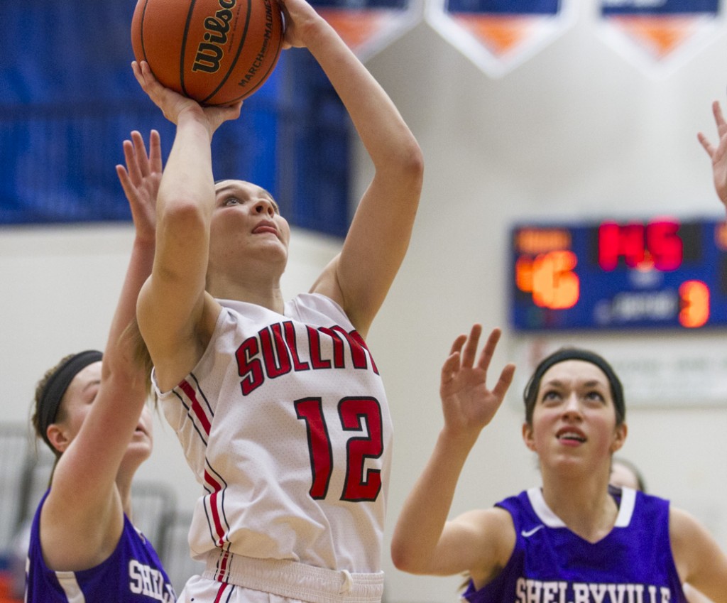 Photo by Keith Stewart Emily Neuhauser eyes the basket from below Tuesday. Neuhauser finished with 25 points as did Brittin Boyer.