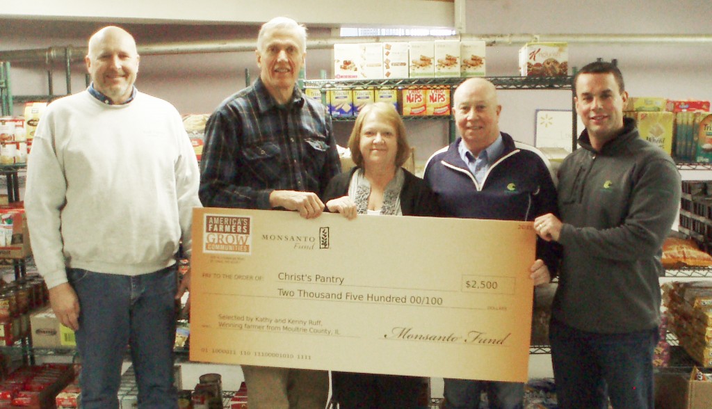 Photo by Barry Morgan Pictured left to right: Ken Ruff (Winning farmer’s husband), Al Rennert (Christ’s Pantry), Jane Franklin (Christ’s Pantry), Greg Watters (Monsanto representative), Larry Adams (Monsanto representative)