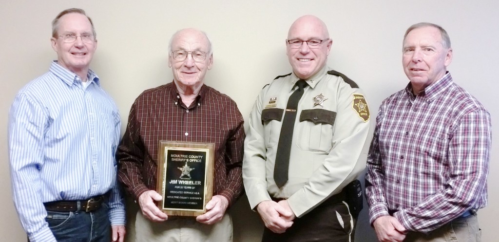 Submitted Wheeler’s 33 Years Recognized The Moultrie County Merit Commission presented member Jim Wheeler a plaque of appreciation for his 33 years of service to Moultrie County as a member of the Moultrie County Merit Commission. Pictured, from left to right:  Former Sheriff Jeff Thomas, Jim Wheeler, Sheriff Chris Sims, former Sheriff Rieck Kendall. Wheeler’s last day as a member of the commission was December 1. Thomas was selected by the county board to replace him.