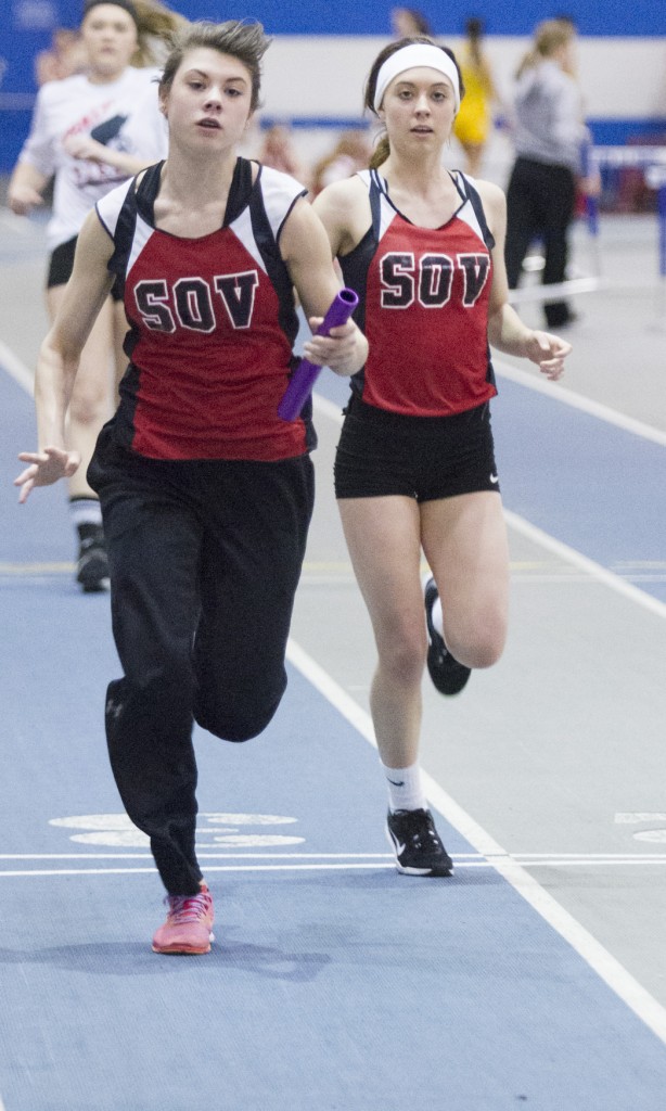 Photo by Keith Stewart SOV sophomore Ashlynd Risley takes off after receiving the handoff from freshman Bailey Turnbaugh during their 4x200 warmup Saturday morning in Charleston. The relay later came away with first place.