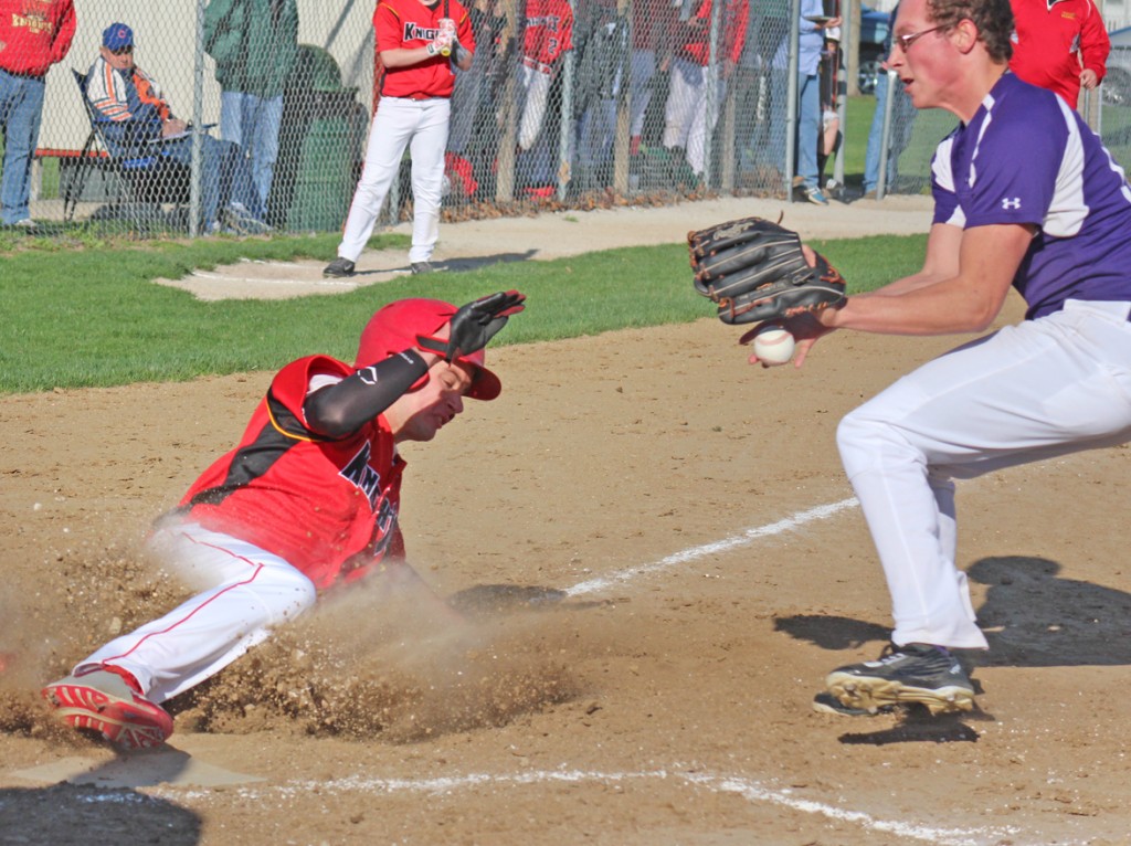 Photo by RR Best Avery Schrock slides into home Friday afternoon. When Schrock wasn’t sliding across the plate, he was hurling curveballs. The senior earned the win on the mound after holding Arcola to four hits over five innings while striking out three and allowing the lone run.