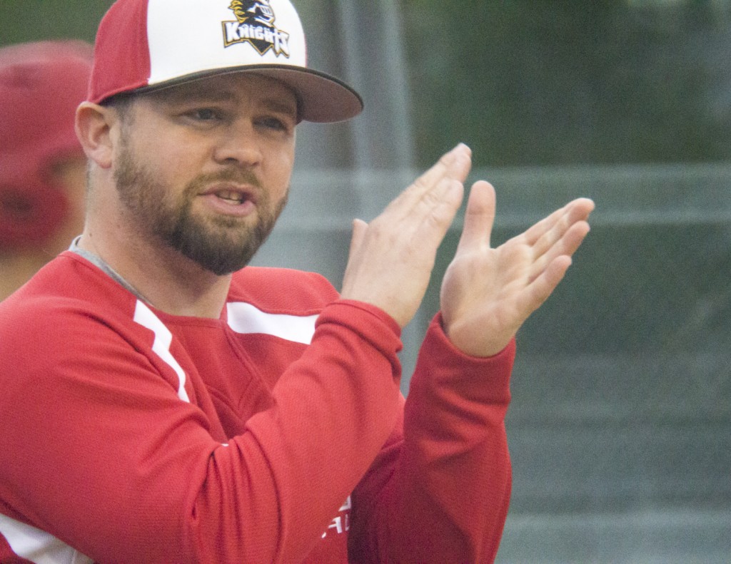 Photo by Keith Stewart Arthur-Lovington/Atwood-Hammond head coach Craig Moffett encourages his team during last Friday’s contest against Cerro Gordo-Bement. The Knights were able to pick themselves up after a poor first two innings to come back and win 11-5.