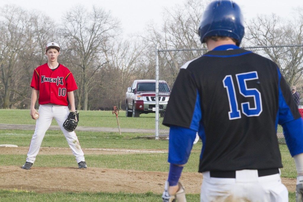 Photo by Keith Stewart ALAH pitcher Kirk Herschberger eyes Peyton Hagerman at third base during the seventh inning Tuesday.  A three-error seventh helped the Timberwolves to five runs to take the game 10-0.