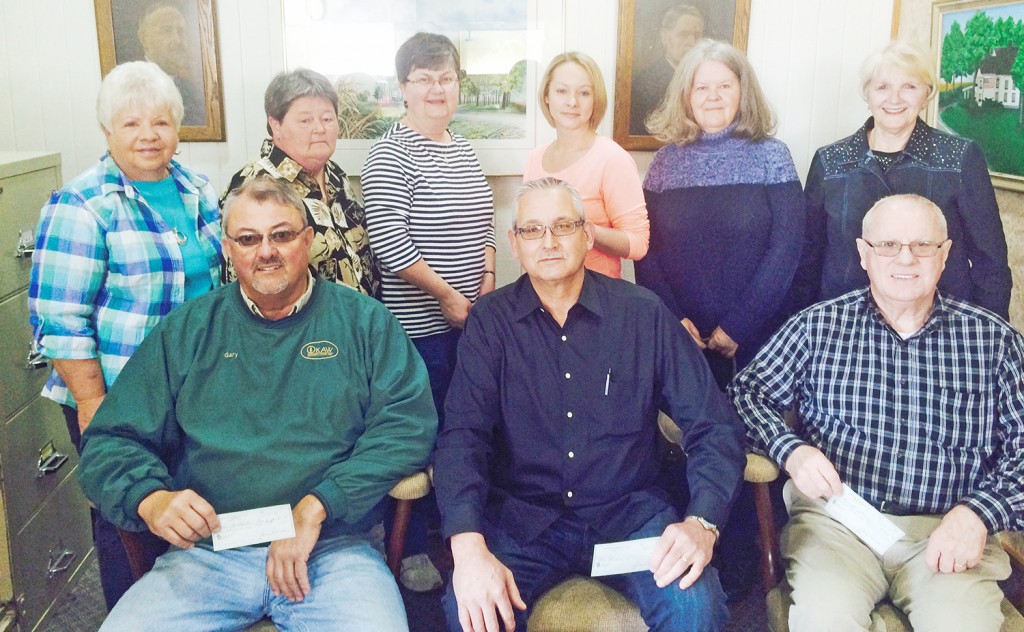 Photo by Sally Foley Lovington Community Club Donation The Lovington Community Club donated a total of $2100 to seven area organizations ($300 each), which were represented by the following individuals: seated left to right are Gary Smith (Lovington Ambulance Corporation and the Lovington Fire Department), Rodney Houser(Churches of the Lovington Area), and Leroy Fair (Lovington Alumni Association). Standing left to right are Norma Brust, Linda Alumbaugh(Christ’s Food Pantry), Darlene Barlow (Lovington Library), Jessica Mercer(Sparrows), Pam Nottingham, and Carol Smith. Brust, Nottingham, and Smith represented the community club. 