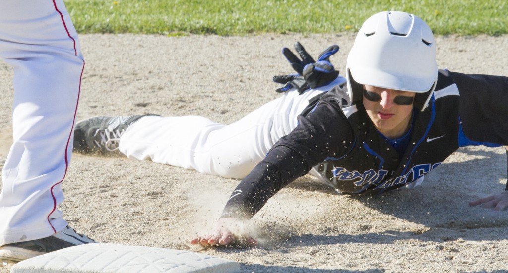 Photo by Keith Stewart Okaw Valley sophomore Taylor Coleman reaches for first on a throw-out attempt Monday.