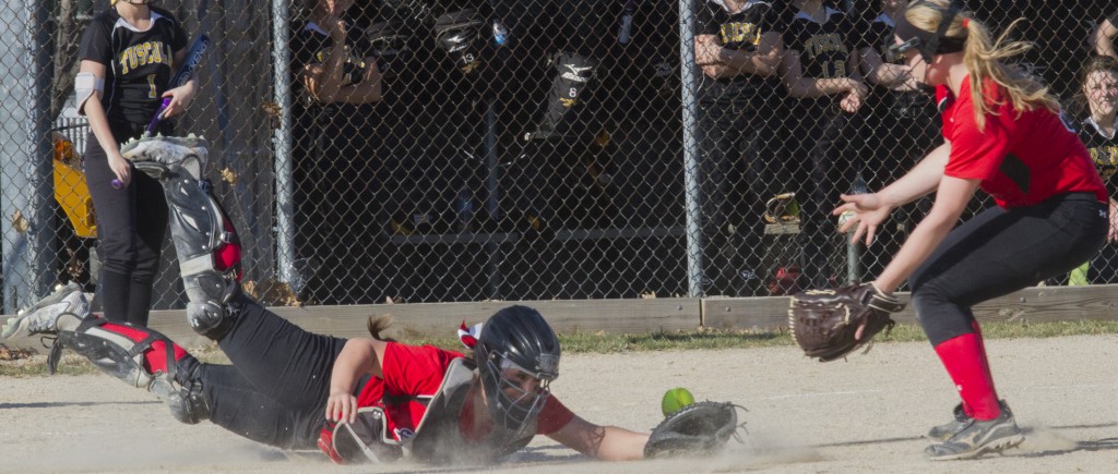 Photo by Keith Stewart Sullivan catcher Makenzie Ruppert tries to make a diving catch while short stop Elissa Stewart rushes in to help.