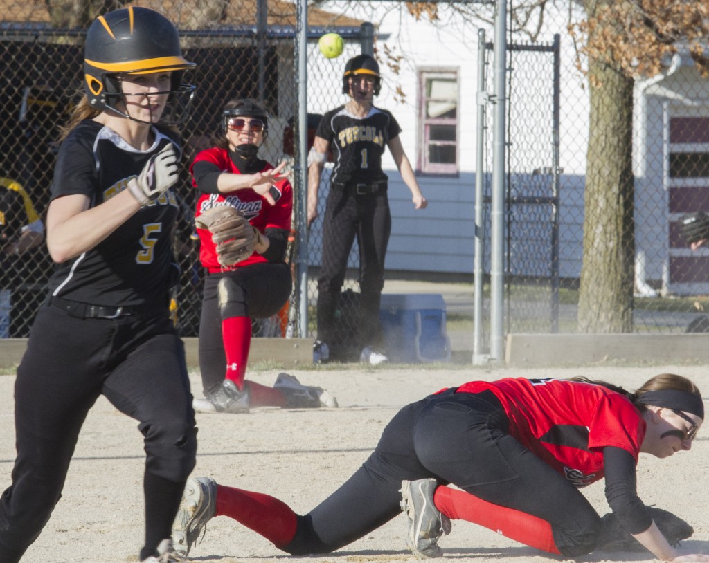 Photo by Keith Stewart Sullivan third baseman Kailyn Boyer tries to make the putout at first with a throw over older sister Brittin.