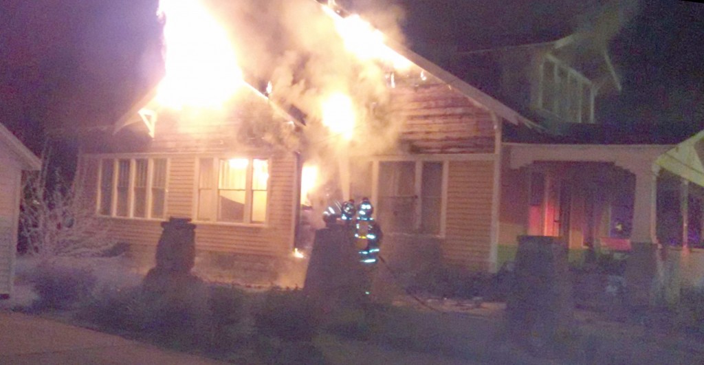 Photo Submitted by Kade Grimm Flames are seen engulfing the exterior of an abandoned house located at 409 N. Washington Street in Bethany Friday.