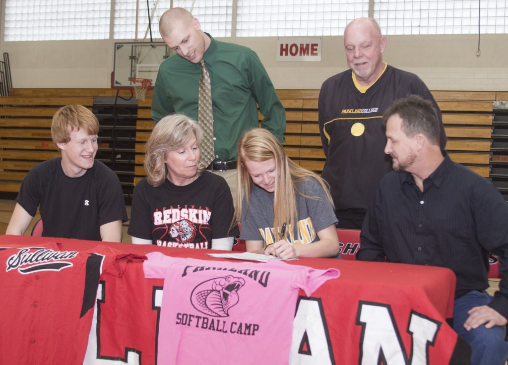 Photo by Keith Stewart Sullivan senior and softball player Elissa Stewart signed her letter of intent committing to play softball at Parkland in a ceremony held January 28. Pictured, front row, from left to right: brother Blake, mother Amy, Elissa, and father John. Back row: Sullivan head softball coach Ben Richter and Parkland head softball coach Chuck Clutts.