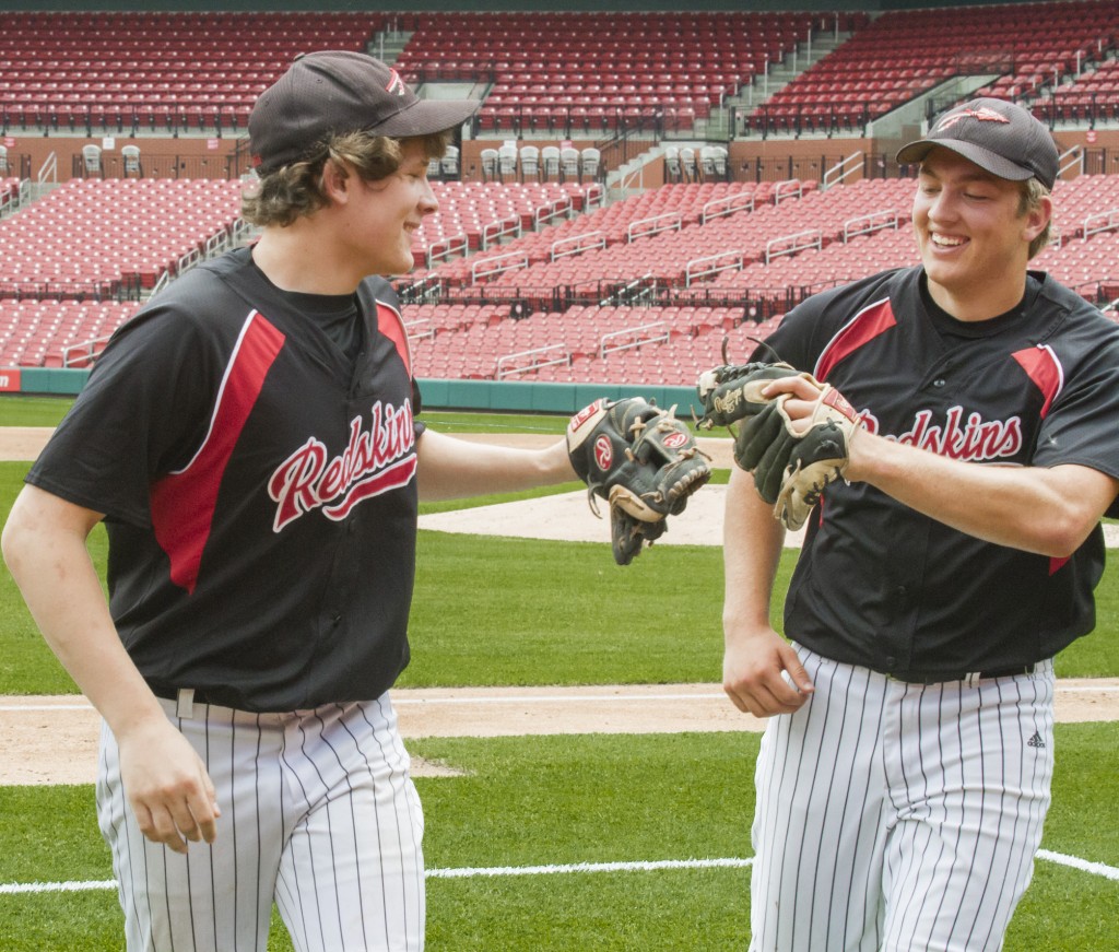 Photo by Keith Stewart Bryce Farris (left) and Nick Frerichs (right) bump gloves after Farris’ quick lineout grab at third in the bottom of the third.