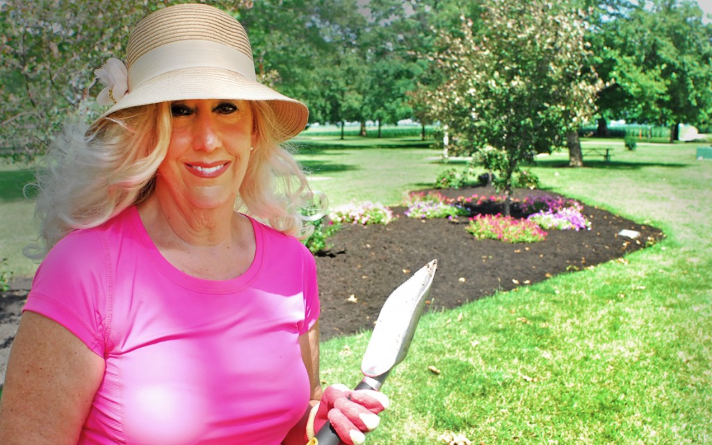 Photo by RR Best Pictured is Kim Warren with her newly planted display at Wyman Park in the background. The display serves as a memorial for Warren’s father, mother, and brother-in-law, all of whom lost their battles with cancer. The memorial was completed just in time for this past weekend’s Relay for Life.