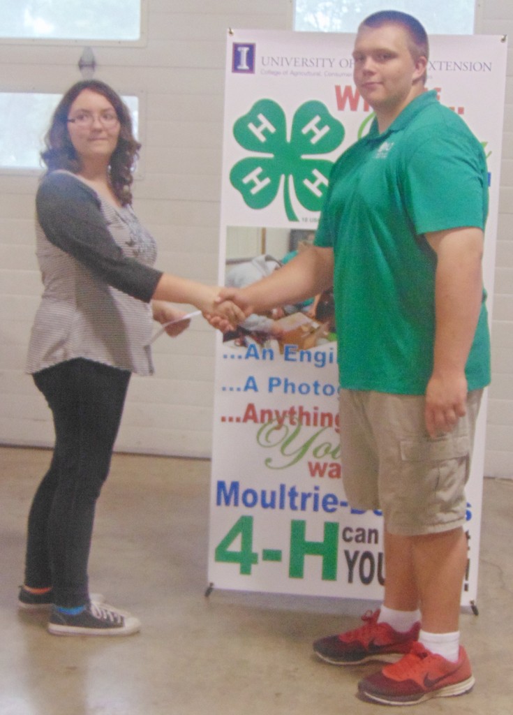 Submitted Pictured (left) is Janae Hopper of Allenville receiving her Grand Champion award  from (right) Hunter Dyer Moultrie-Douglas Jr. Leader President.