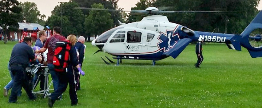 Submitted Pictured are emergency personnel meeting with a Life Flight helicopter, which transported Christina Sanders from Arthur to Carle Hospital Tuesday evening after she was stuck by a vehicle in rural Sullivan.