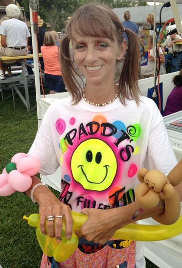 Photo by RR Best Patti Woods of Shelbyville provided Windsor Picnic crowds with some of Paddi’s Air Filled Fun on Saturday. She  shaped balloons into a variety of animals and flowers for an appreciative group.