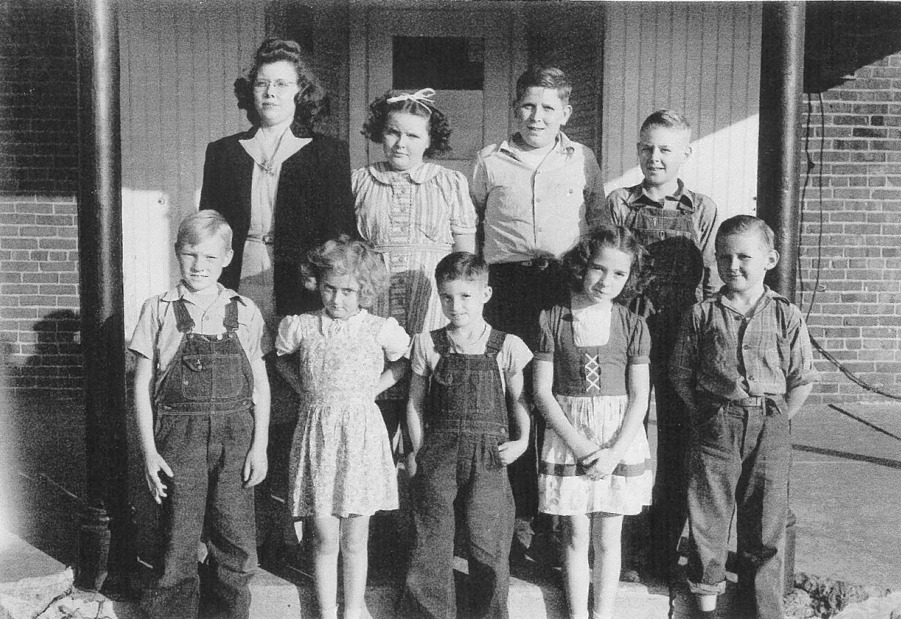 Moultrie Moment of the Week                                                    Pictured above are students from Dry Ridge School (Lowe Township) in the mid 1940’s Front row, left to right: Wayne Mayfield, Evelyn West, Dale Maycroft, Janice Maycroft, Richard Pankey. Back row, left to right: Teacher, Lorraine Steck, Joyce West, Garvin West, Herbert Lee Rigg. Please submit photos to the News Progress for future consideration. Originals will be saved for return or forwarded to Moultrie County Historical Society. If you have any other information, please contact the Moultrie County Historical Society at 217-728- 4085.