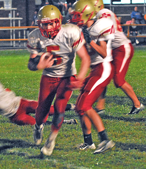 Photo by Mike Brothers ALAH Quarterback Teddy Poe worked on the ground Friday against an aggressive Oblong defense. Poe scrambled for 38 yards during the evening.