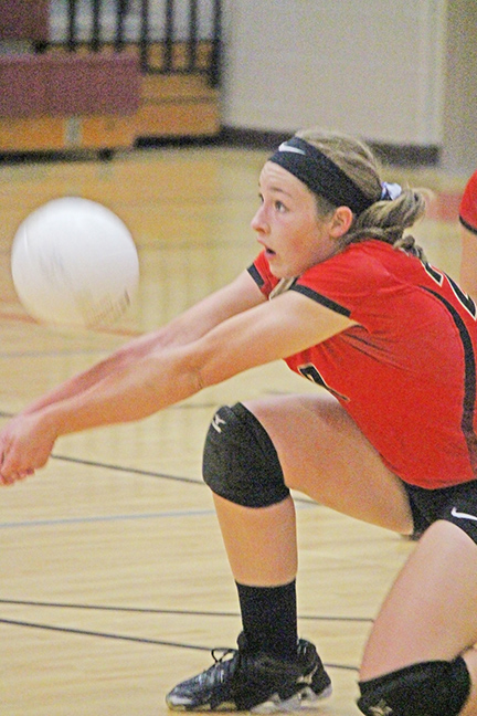 Photo by Darian Hays Taylor Powell of ALAH volleyball goes for dig during last week’s game.