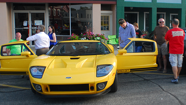 Photo by Mike Brothers Sullivan Cruise Night Sullivan Cruise Night enjoyed one of the best turnouts ever with 110 cars gathering around the Sullivan square for the 35th annual event Saturday, Sept. 5.  Bill Platzbecker’s rare Ford GT drew rave reviews during the show which featured a night cruise of Sullivan at 7 p.m. by members of the Sullivan Street Machine Association which cosponsored the event with AmBucs. Rick Montague of the Sullivan SMA noted the Cruise Night over Labor Day weekend and Car Show in Wyman Park over Memorial Day weekend are the club’s biggest events. Kids enjoyed a bounce house, adults listened to music by Shovelhead and everyone enjoyed free popcorn from the Sullivan Boy Scouts.