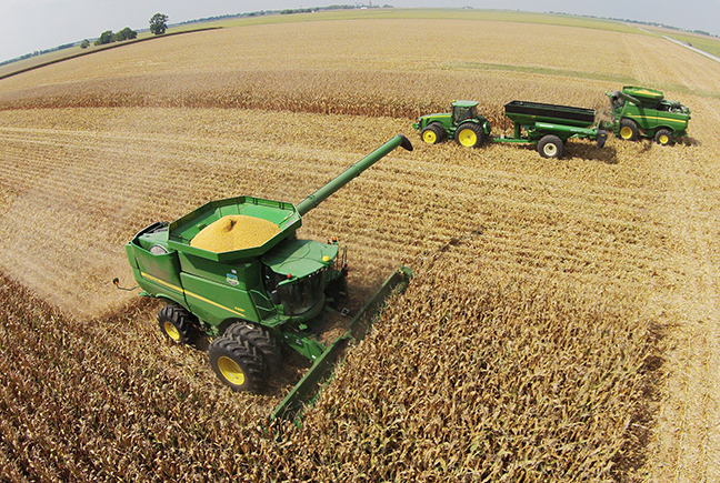 Drone photo by RR Best Farming Progresses Now that the Farm Progress show is a memory, real farm progress is starting in area fields. Gingerich Farms started to harvest acreage near Lovington. This drone photograph shows the Gingerich’s harvesting a field of short season early planted corn last Thursday. “With the hot weather coming this weekend,  the corn harvest will be going full speed in the next two weeks,” Dannie Gingerich said. He explained the yield is less than last year’s record breaker but is still on the high end of the five year average.